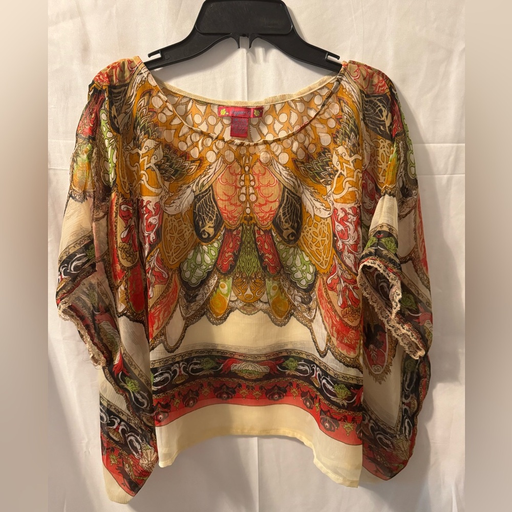 Sugar 17. Pink label over the head sheer top. Size one size fits all.